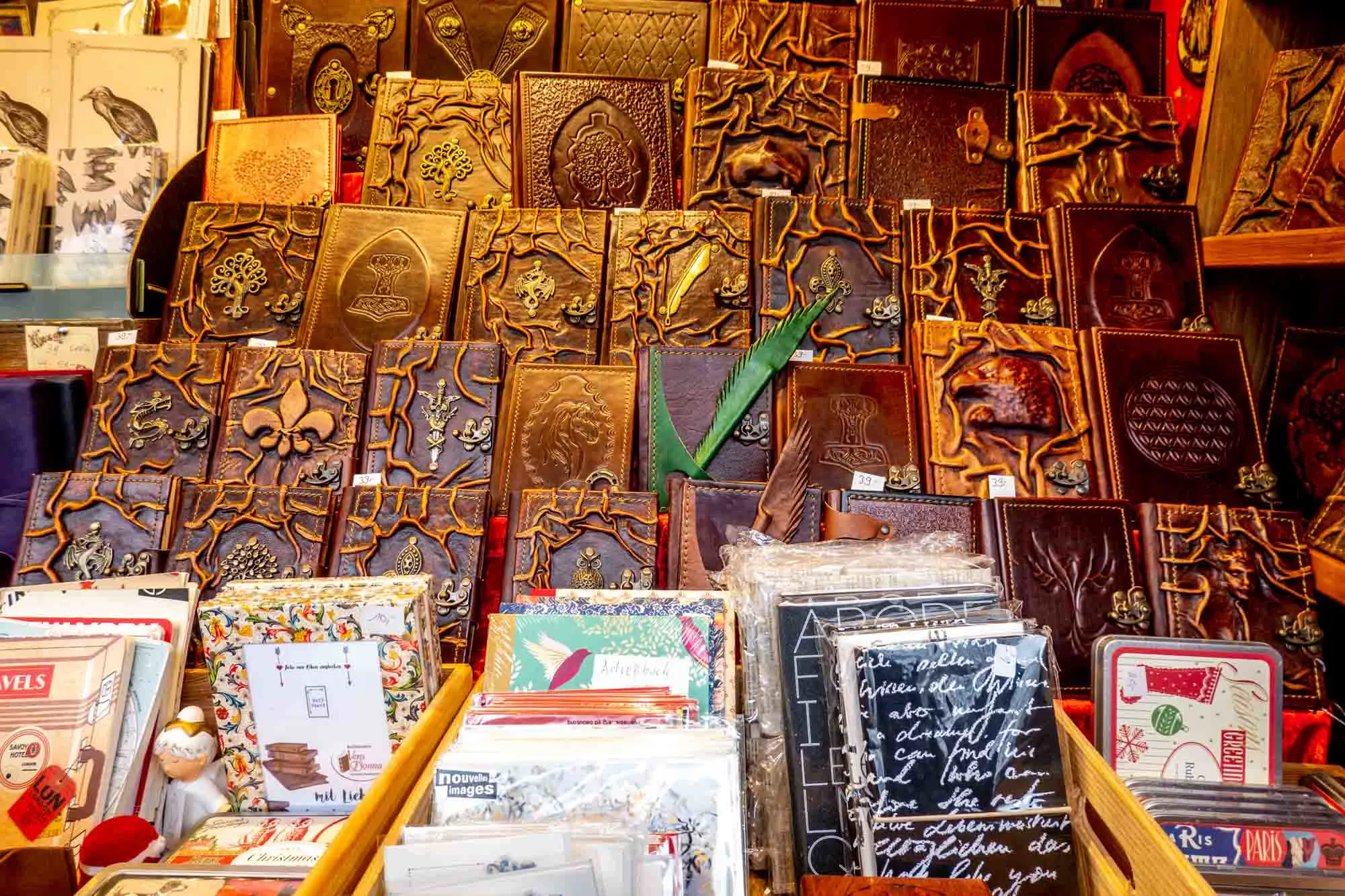 Leather-bound books and stationery displayed for sale at a market