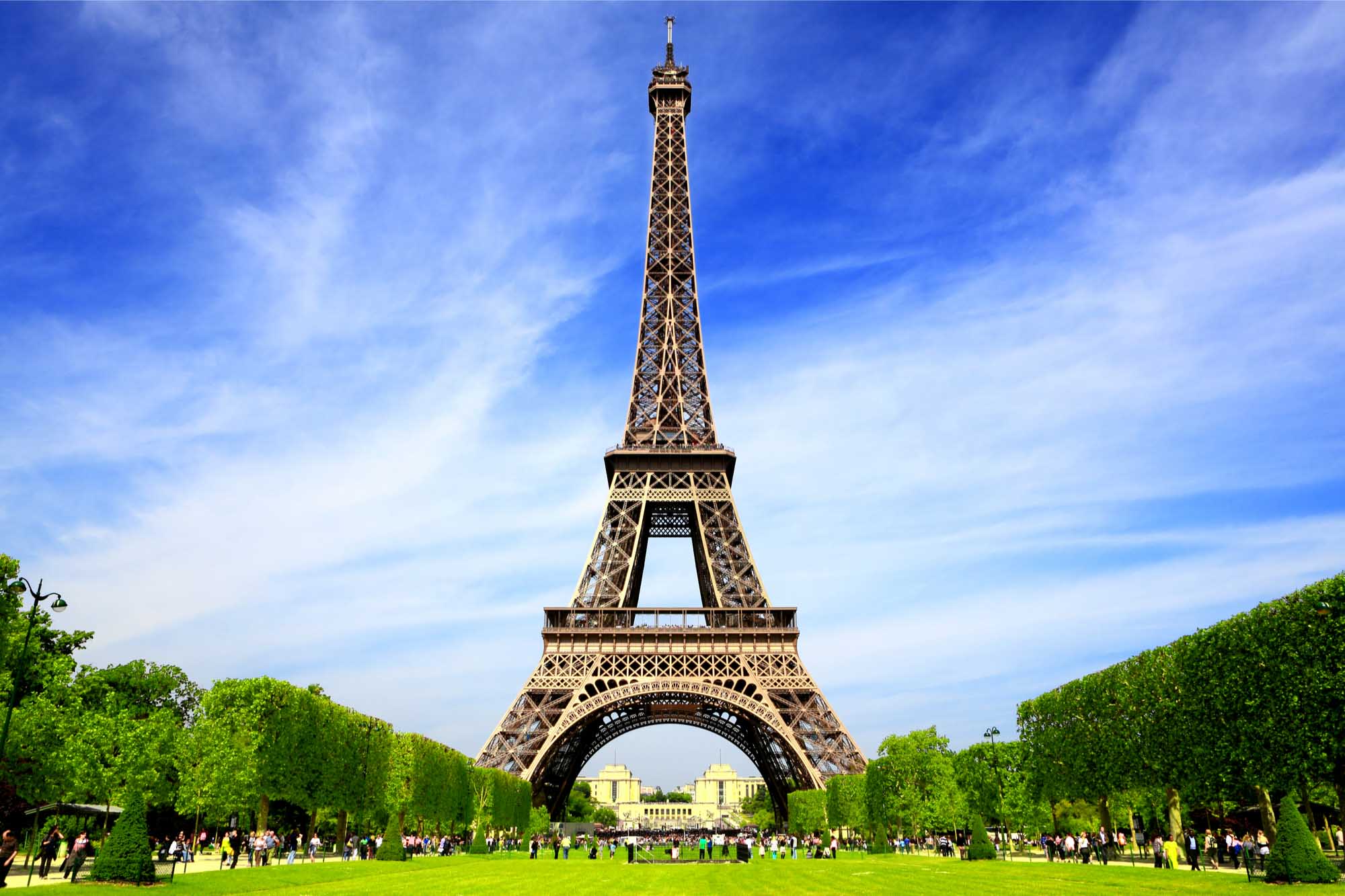 The Eiffel Tower against a blue sky