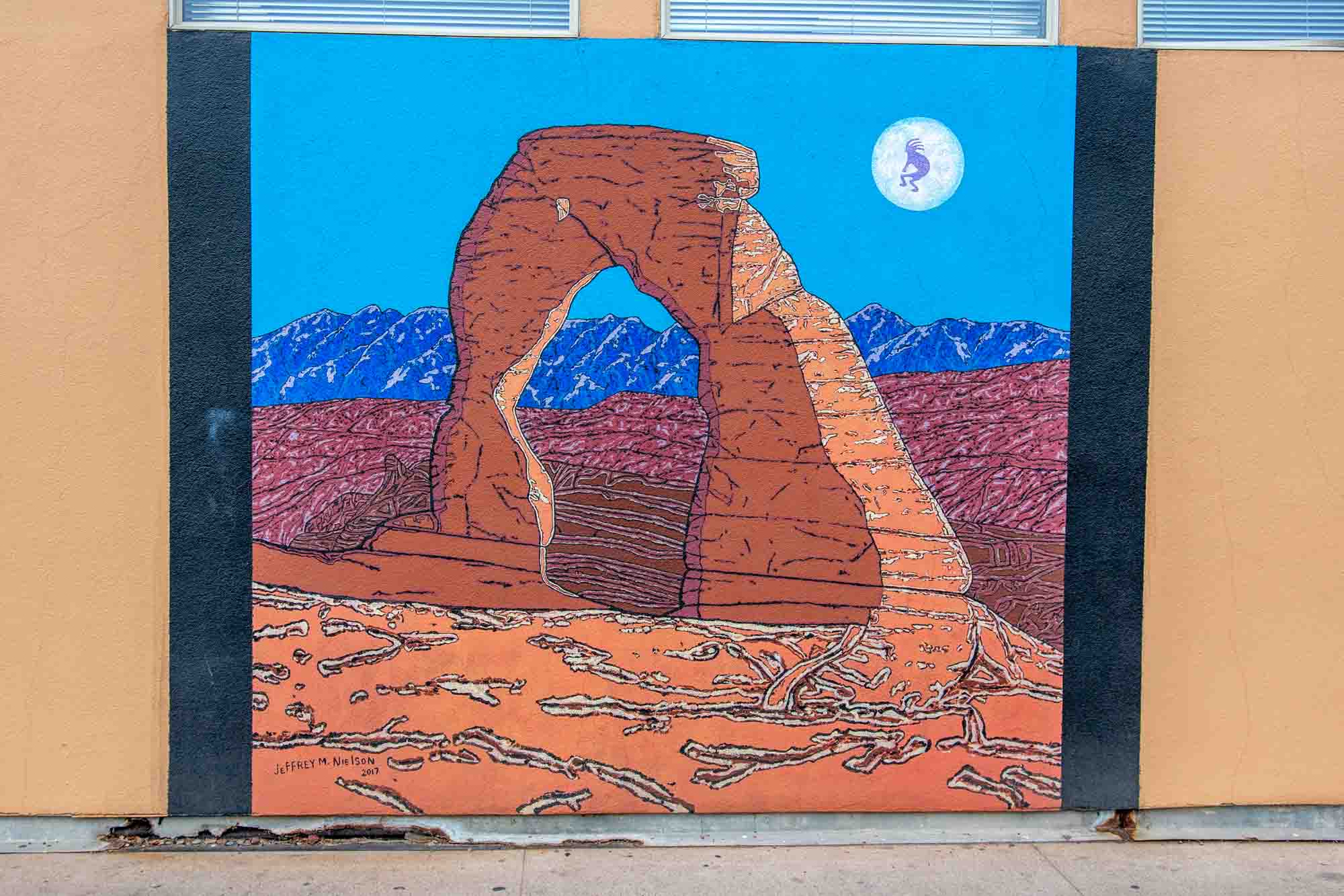 Delicate Arch mural on side of building in downtown Moab