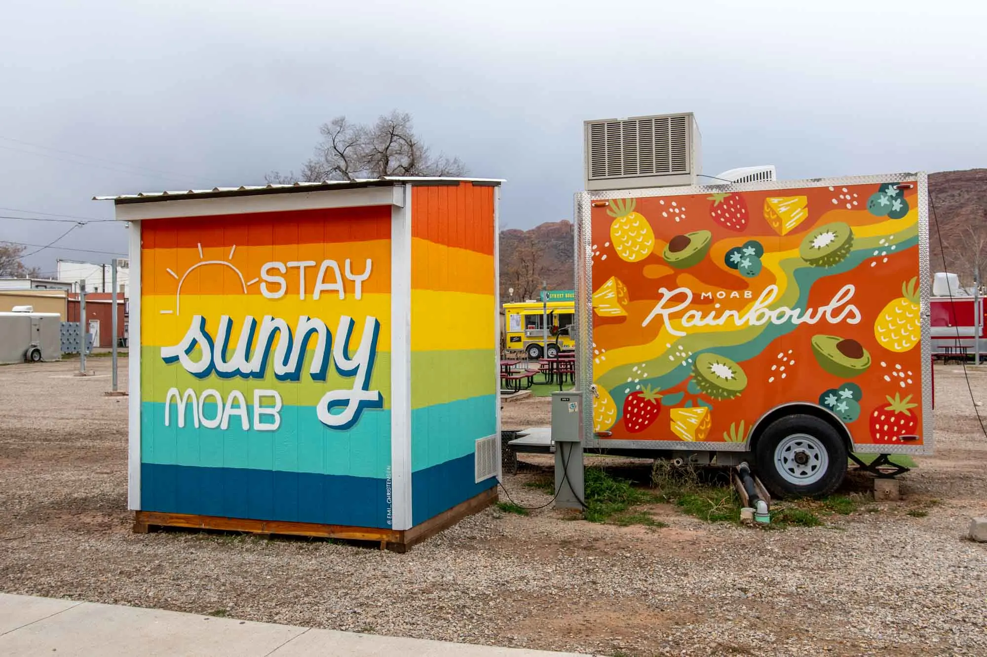 Moab Rainbowls at the food truck park with a painting saying "Stay Sunny Moab"