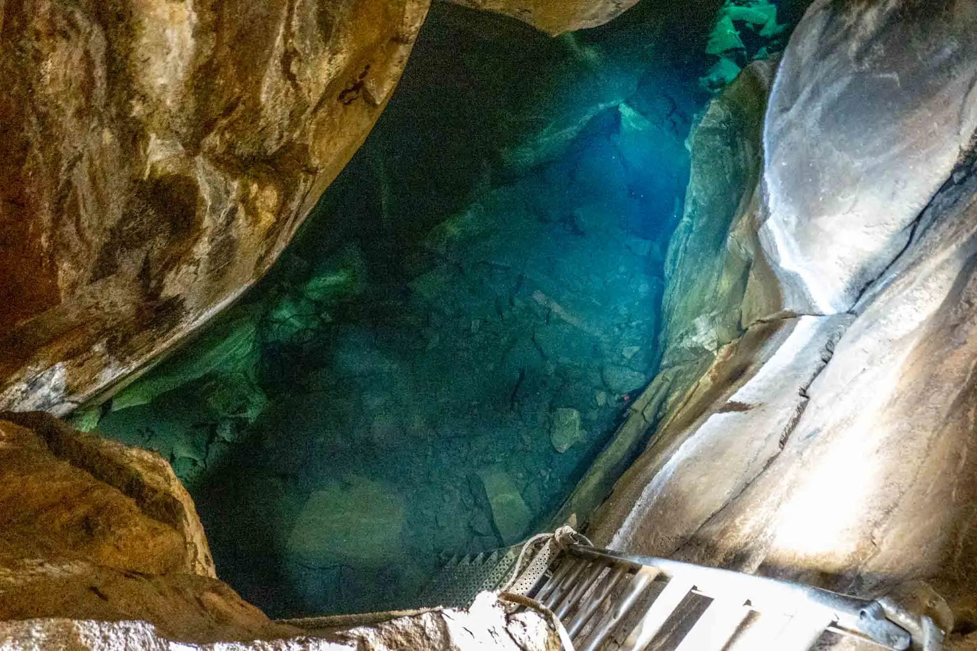 Ladder down into the Stóragjá Cave pool