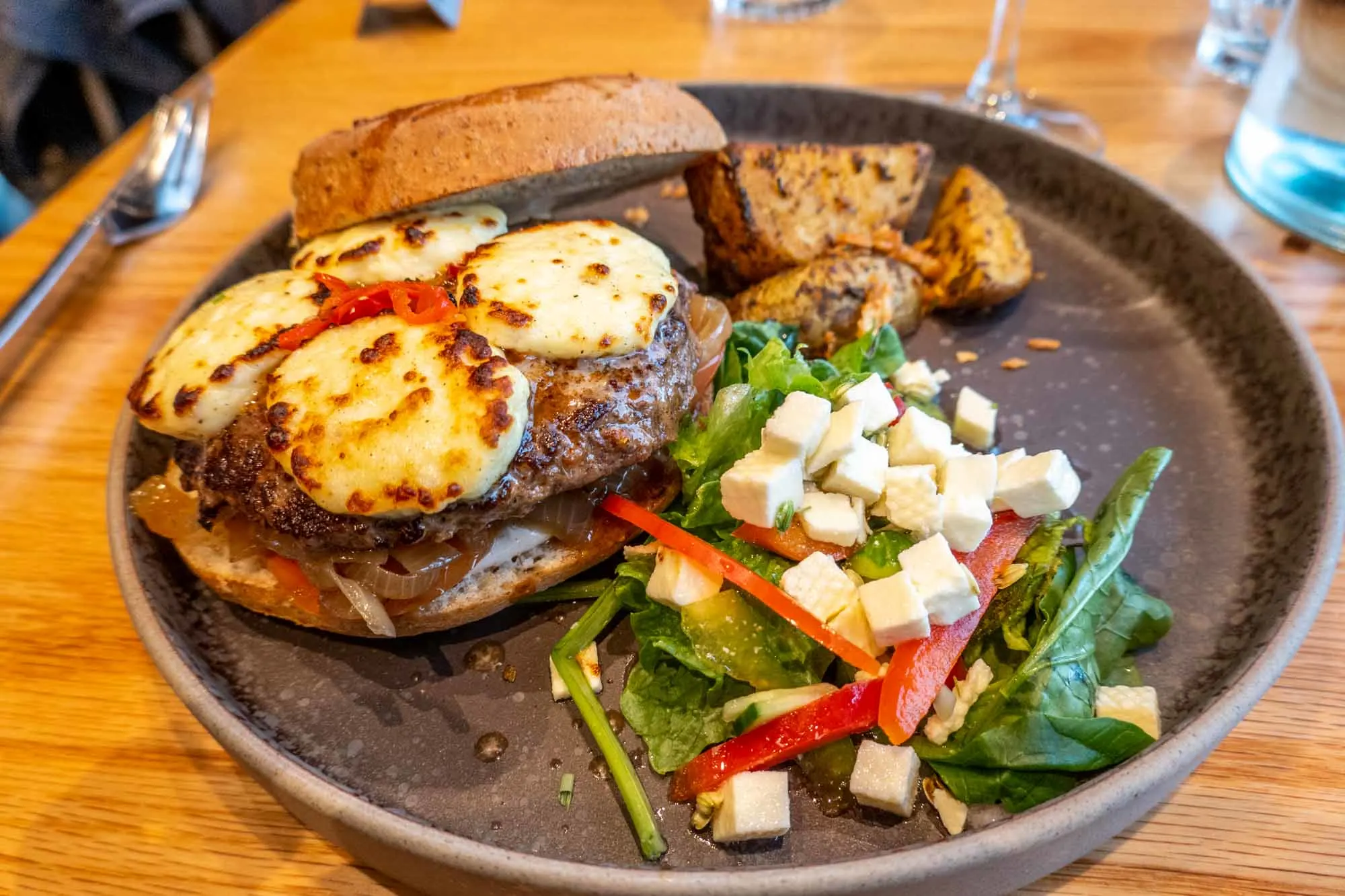 Hamburger with potatoes and salad