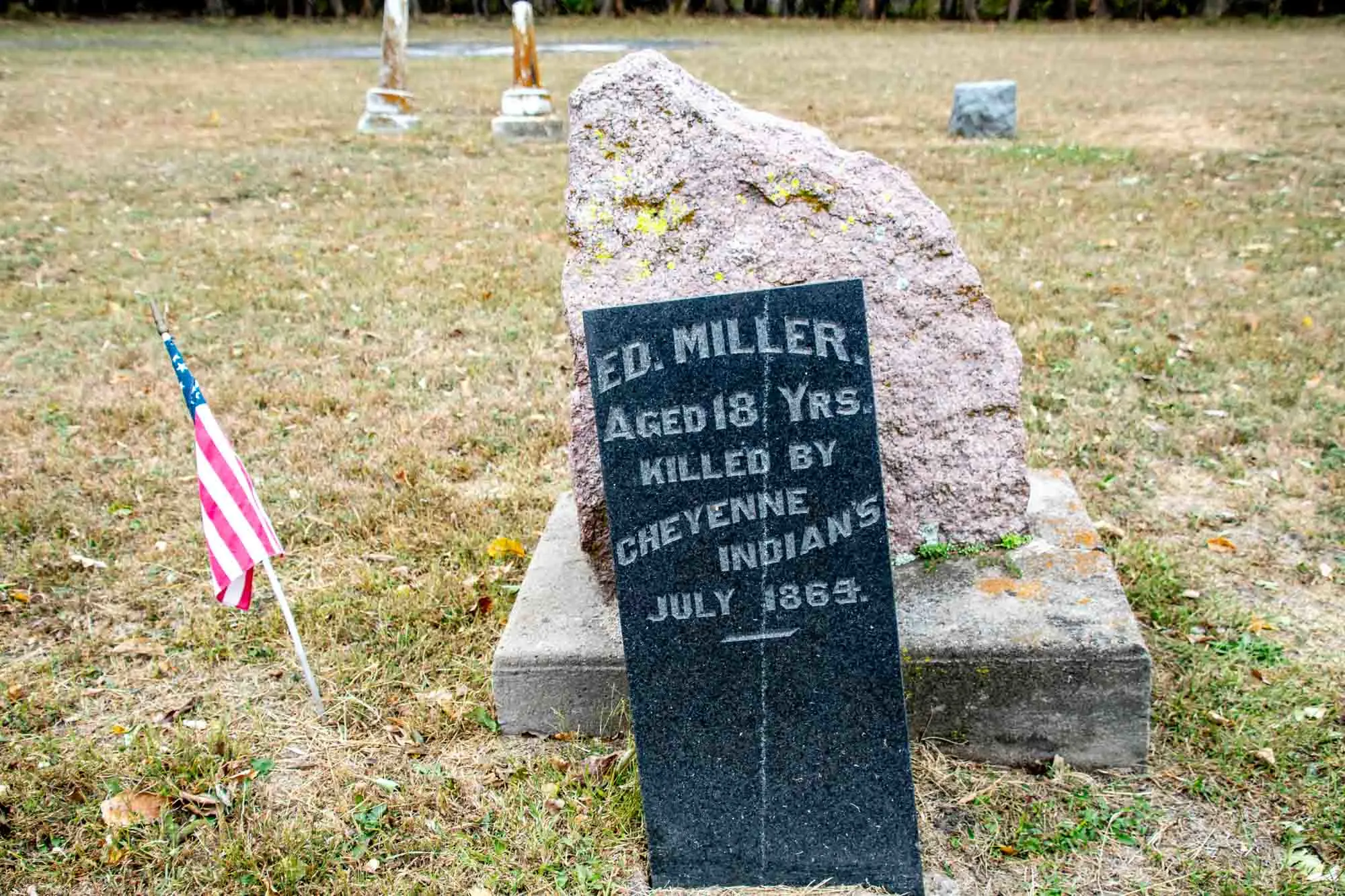 Grave marker reading "Ed. Miller. Aged 18 Yrs. Killed by Cheyenne Indians. July 1864."