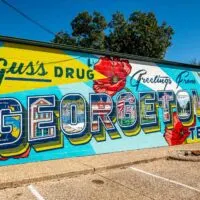Mural with red poppies: Gus's Drug: Greetings From Georgetown, Texas