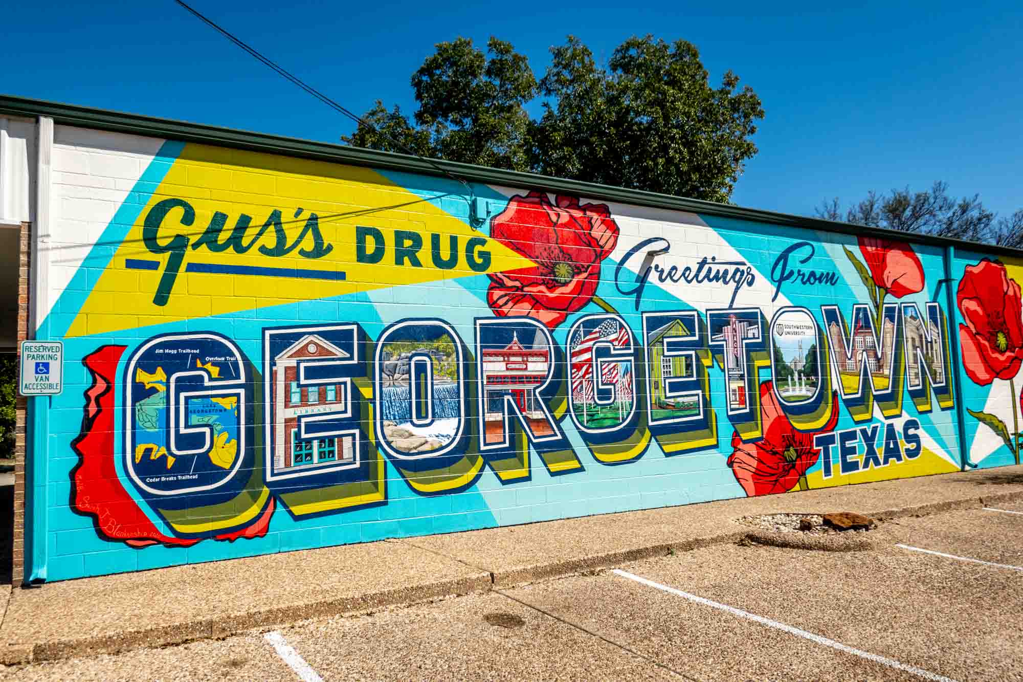 Mural with red poppies: 
Gus's Drug: Greetings From Georgetown, Texas"