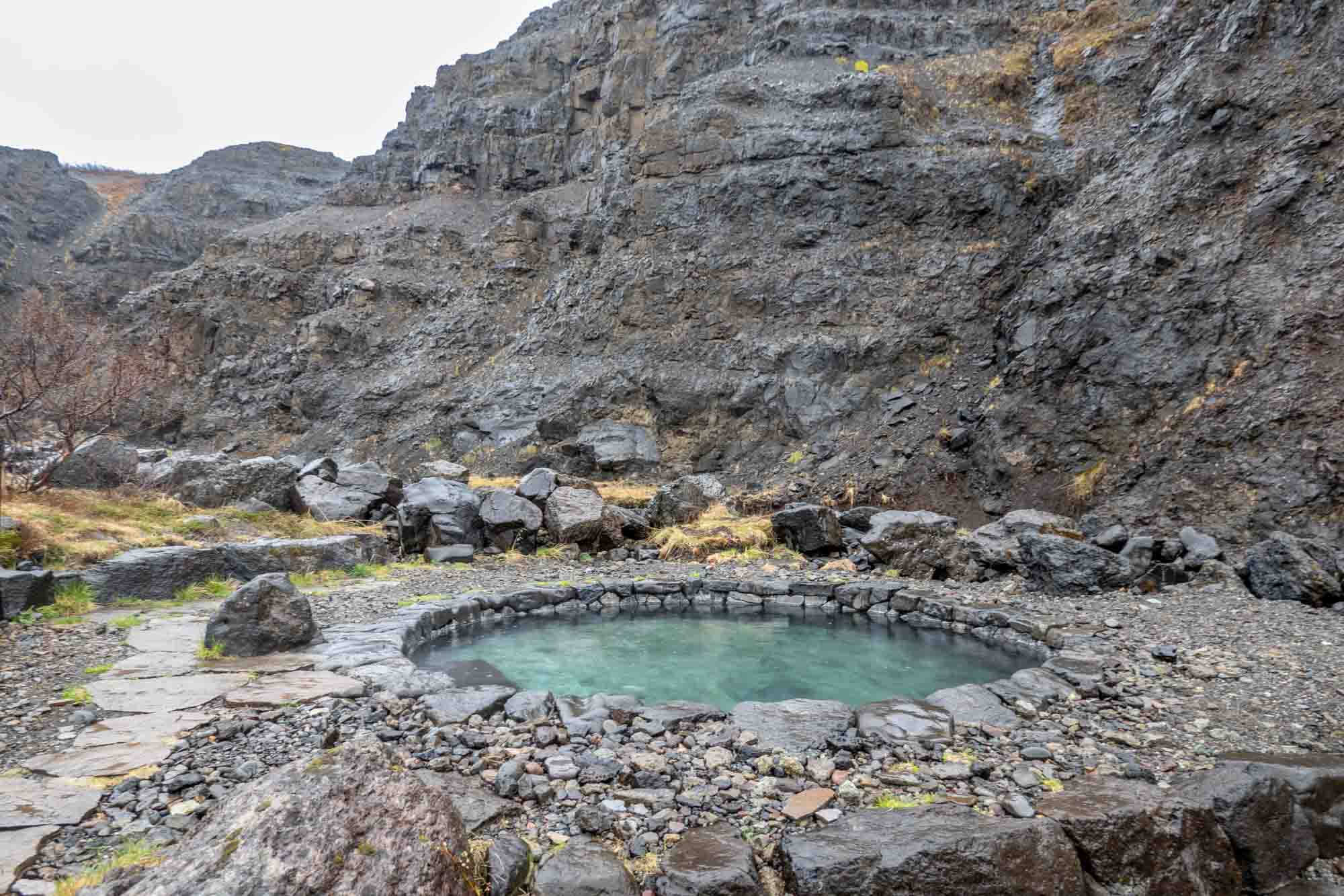 Circular hot springs pool in a canyon