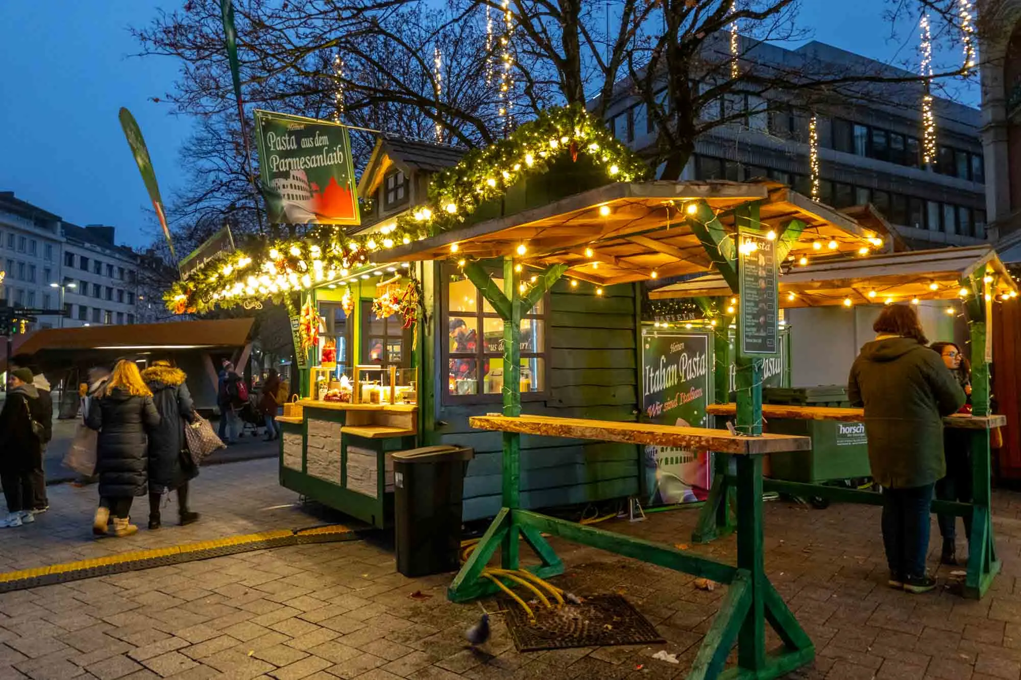 Food stand decorated with lights at night