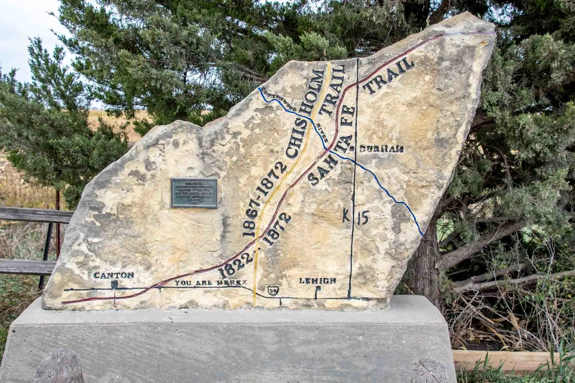 Map carved into limestone depicting the crossing of the Chisholm Trail and the Santa Fe Trail