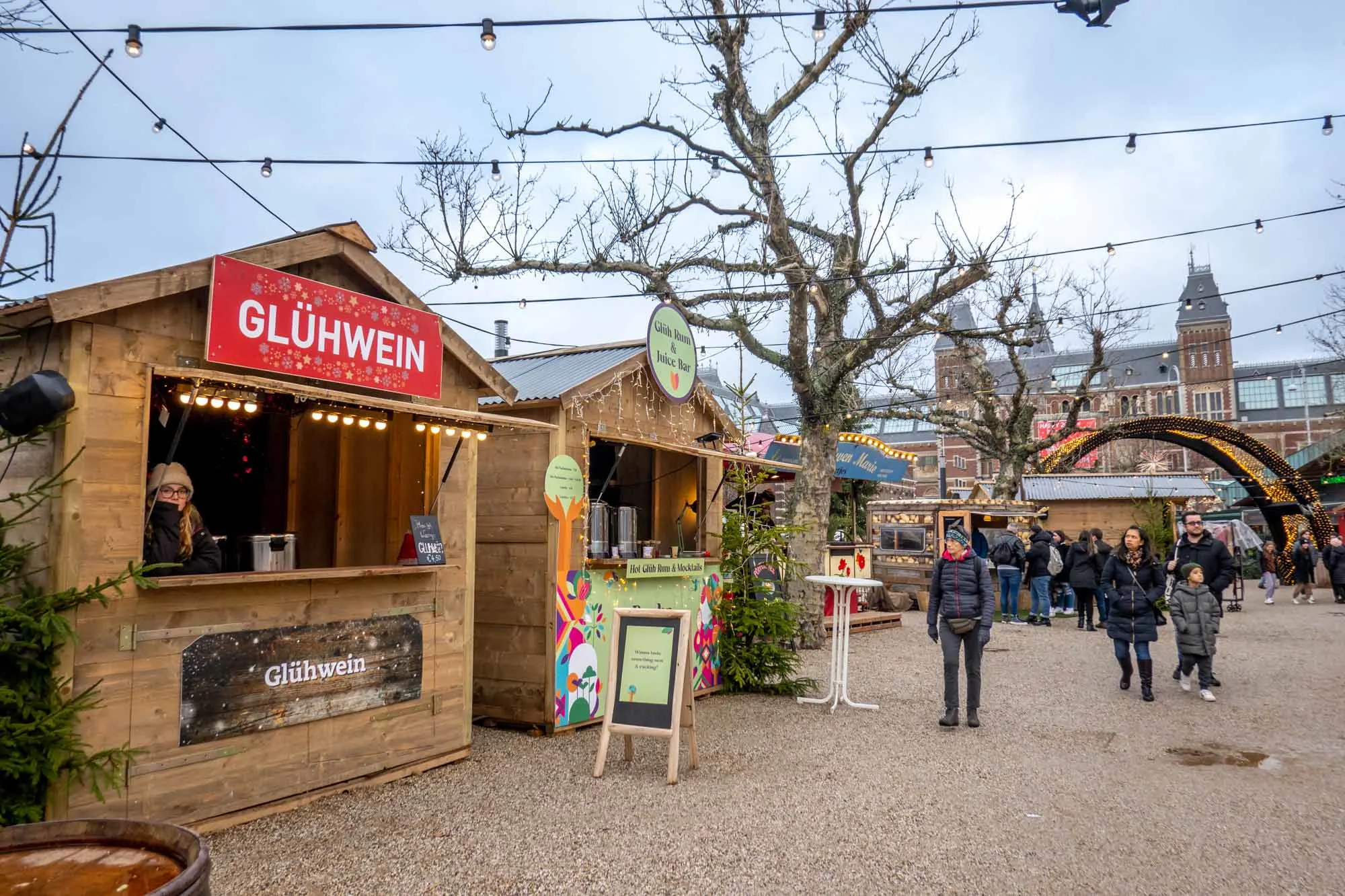 People visiting stalls at a Christmas market.