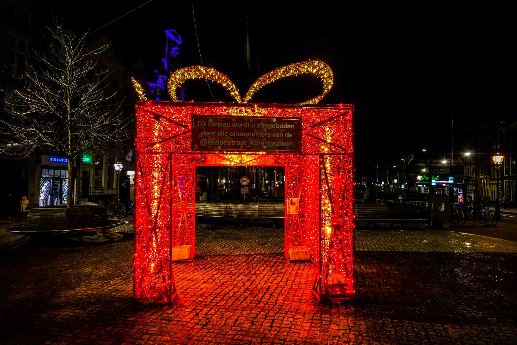 Giant red Christmas present sculpture made of Christmas lights