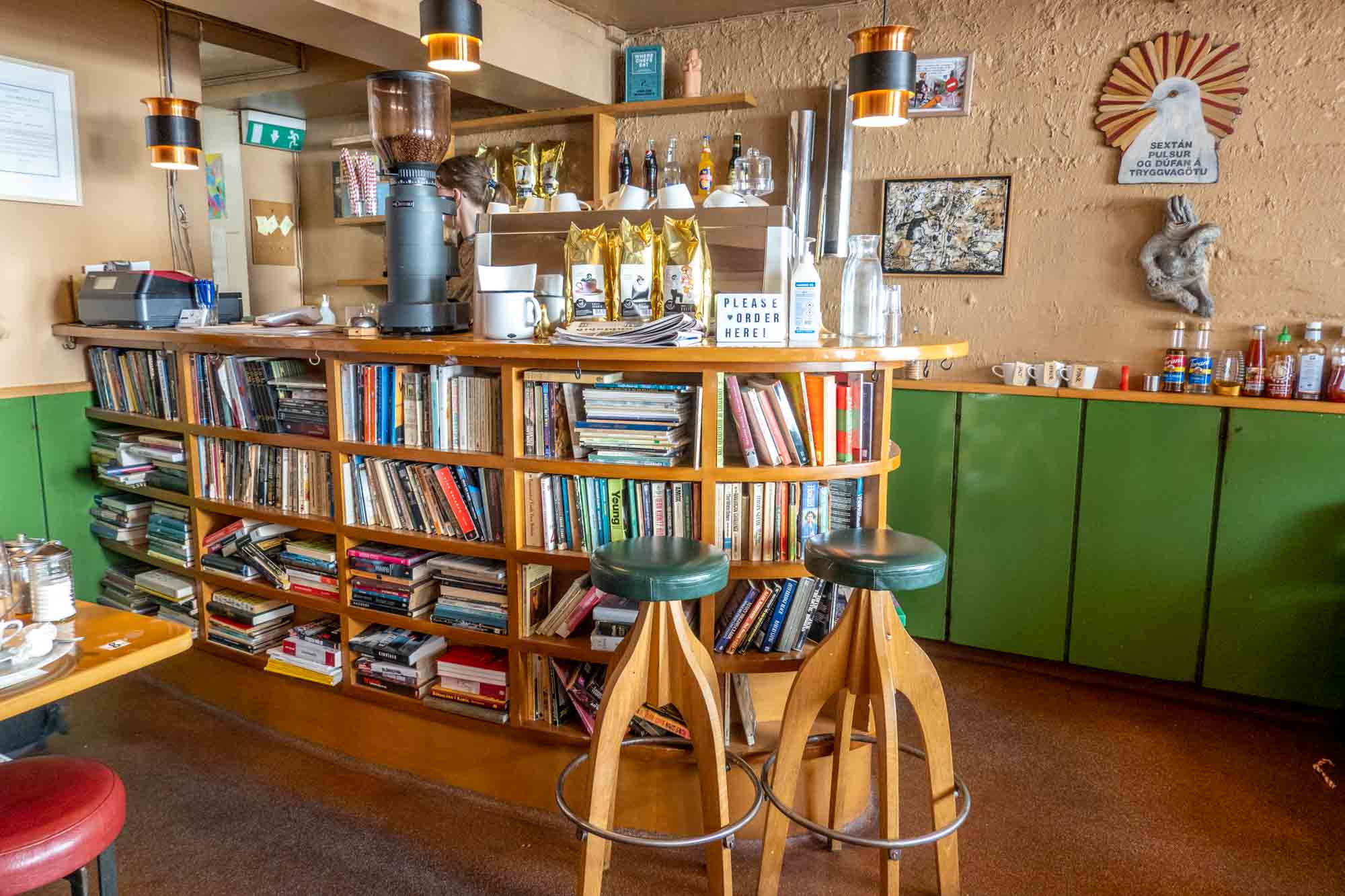 Interior of cafe with coffee bar and books