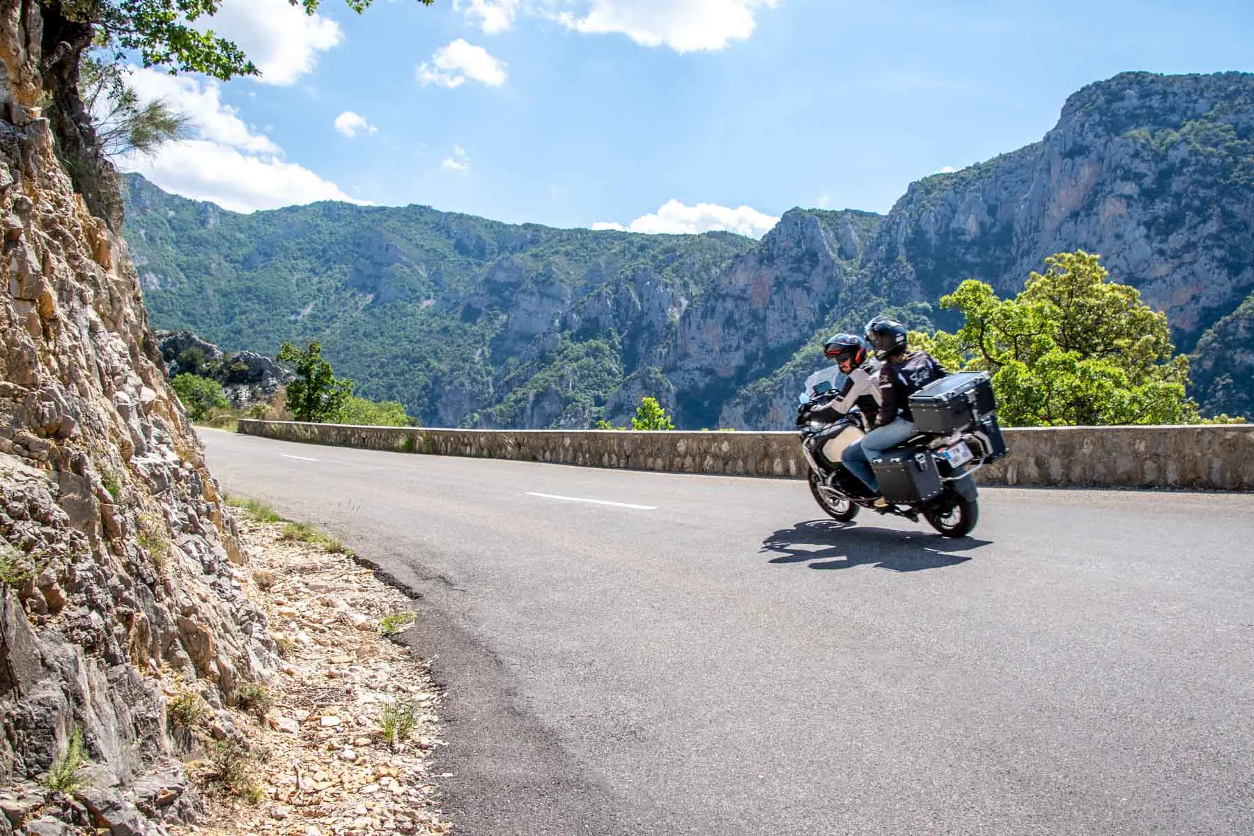 Motorcycle driving along canyon road