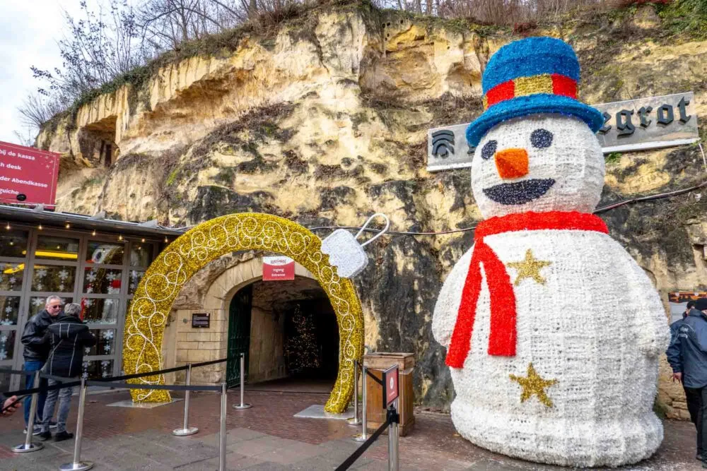 Snowman sculpture at the entrance of a cave of the Valkenburg Christmas market