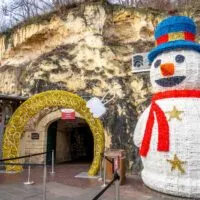 Snowman sculpture at the entrance of a cave of the Valkenburg Christmas market