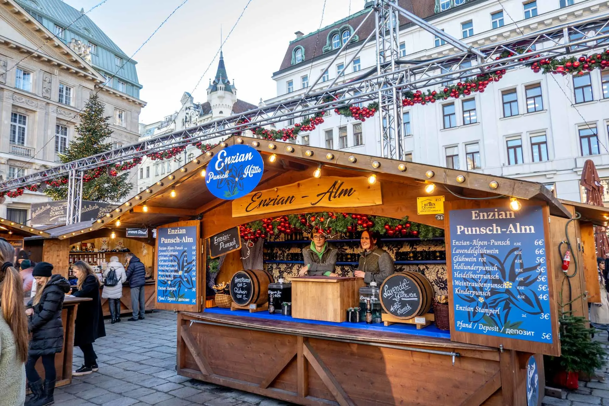 Wooden kiosk selling drinks at a Christmas market.