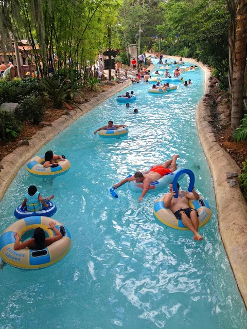 People in inner tubes floating in a lazy river