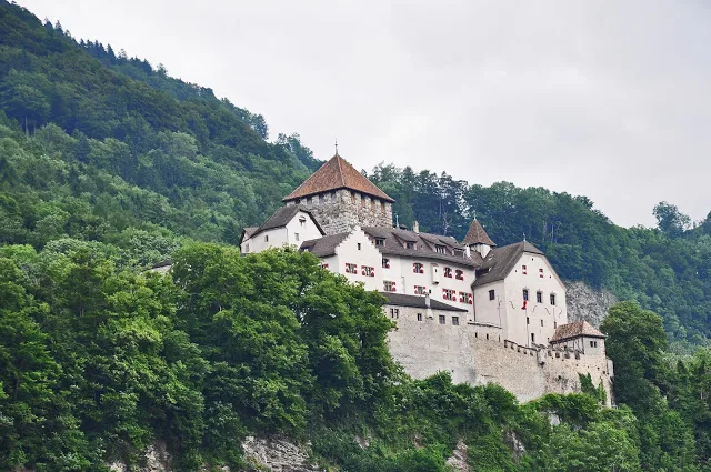 Visit Liechtenstein to see the stone castle on a hillside in Vaduz
